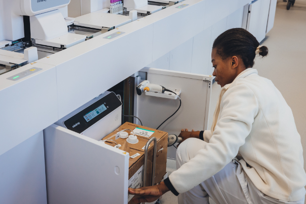 lab expert checking reagent in UNIBIO’s central hub