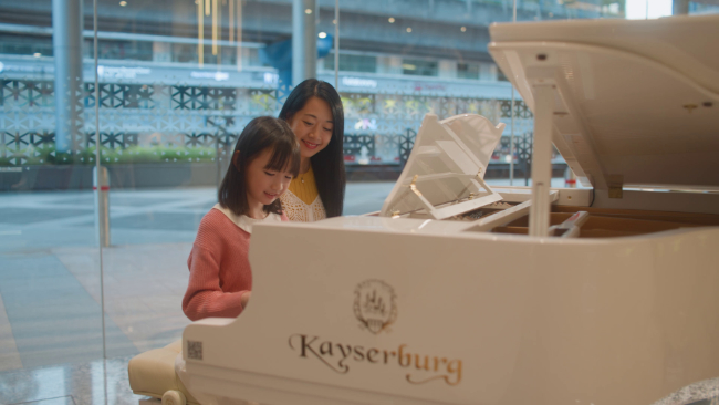 Ties of Pediatric Care - young girl plays piano with her mother in Sunway Medical Centre